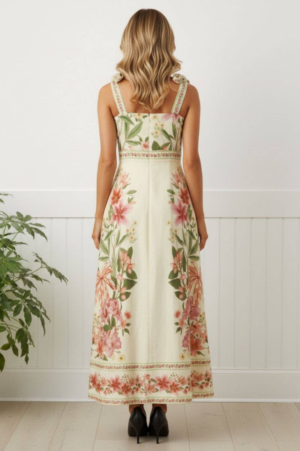 Close-up of bra-friendly tie straps on floral border print midi dress