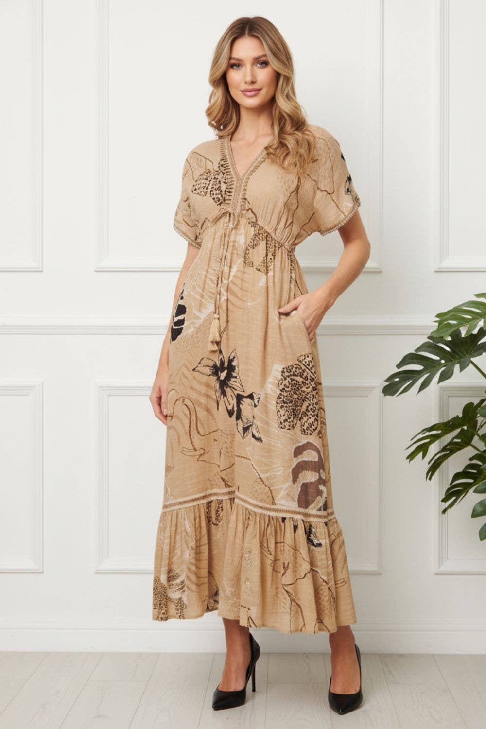 “Printed tassel tie maxi empire dress in beige with V-neck, half sleeves and pockets”