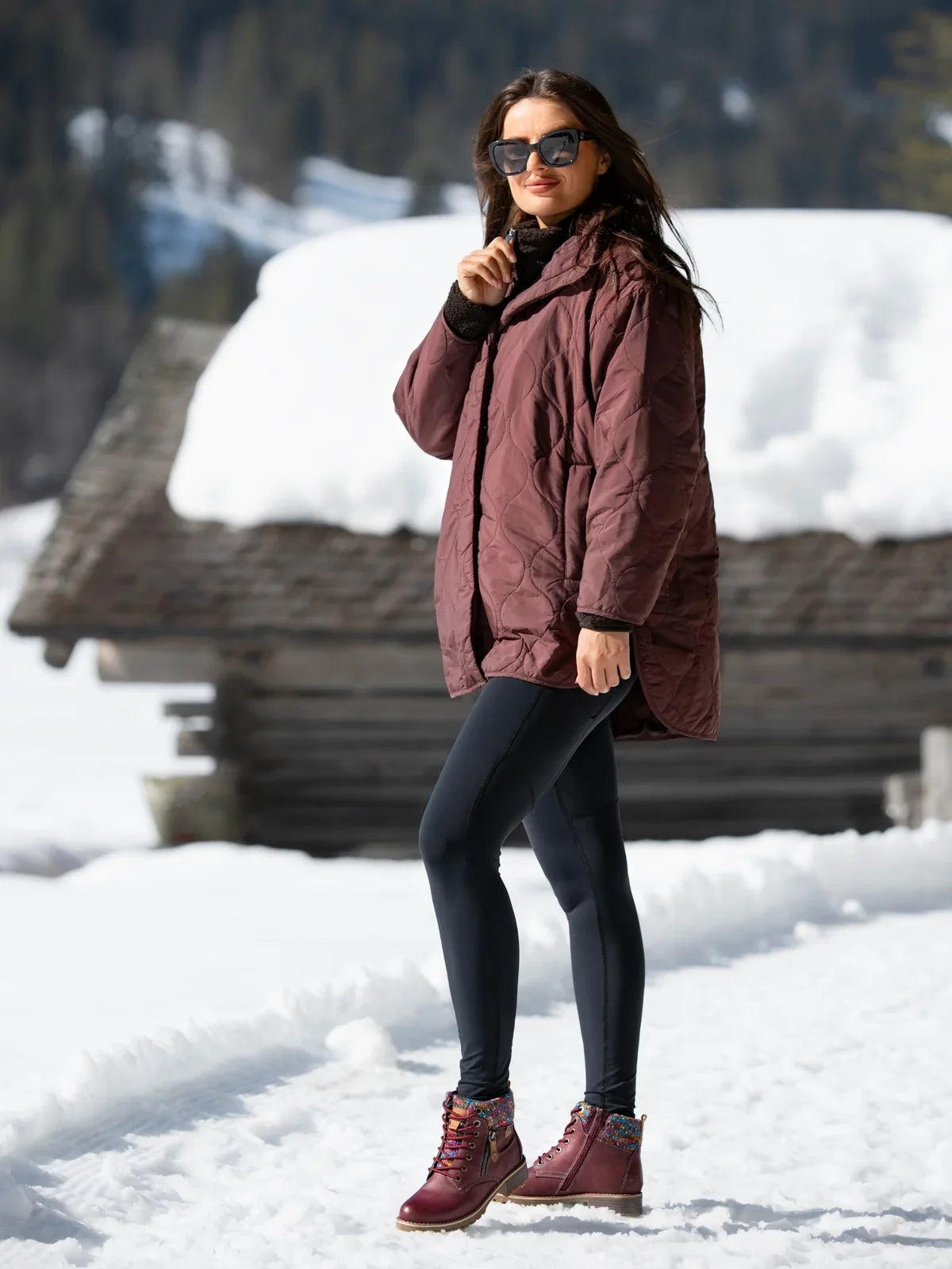 Woman wearing Lunar Tabasco burgundy waterproof ankle boots outdoors